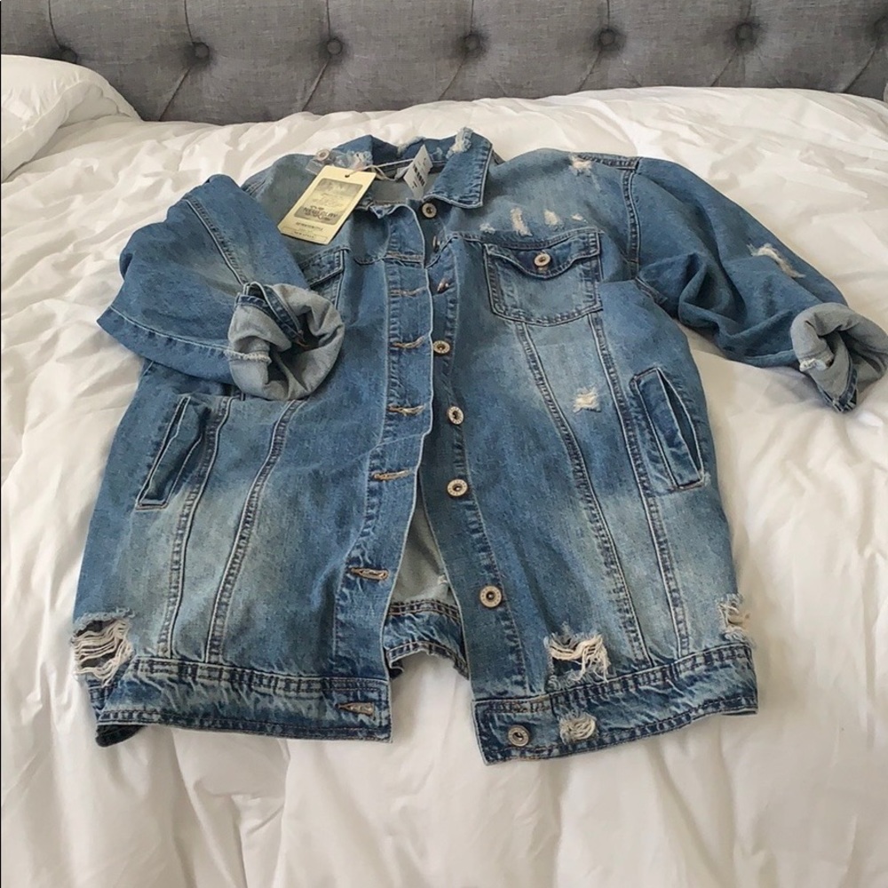 Oversized, distressed denim jacket.
